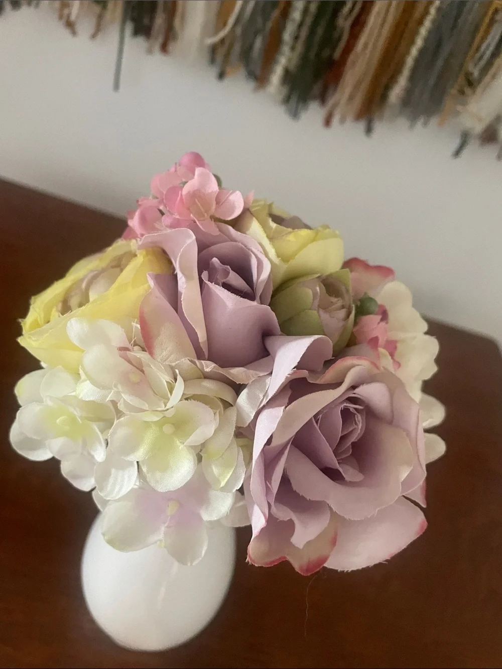 White 6 inch vase with light color flowers